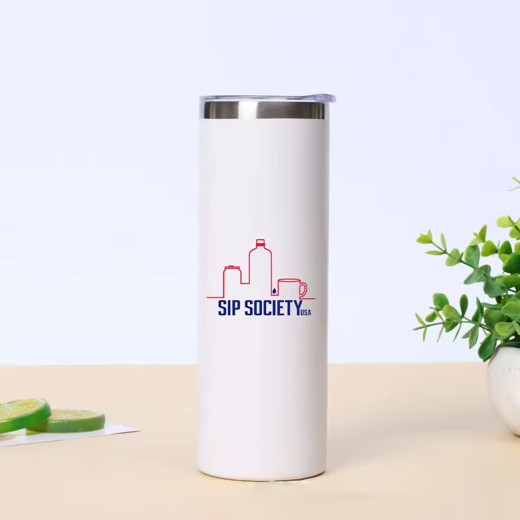 White Premium Stainless Steel Insulated Tumbler | Sip Society USA Custom Drinkware (Copy) featuring a minimalist logo with red and blue line art of drink containers, placed on a light surface with green plant and sliced lime in the background.