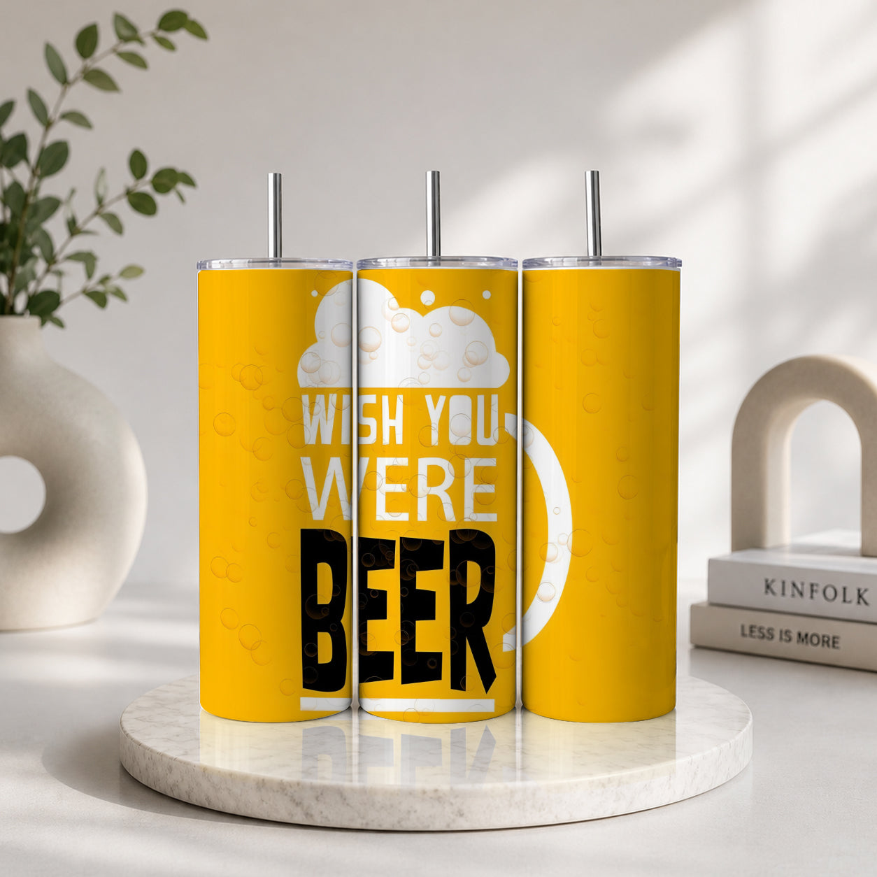 Three yellow tumblers with silver lids and straws arranged to display the phrase “Wish You Were Beer” in white and black text on a foam-topped beer graphic, representing the Wish You Were Beer Tumbler – Funny Beer Lover Drinkware Gift.
