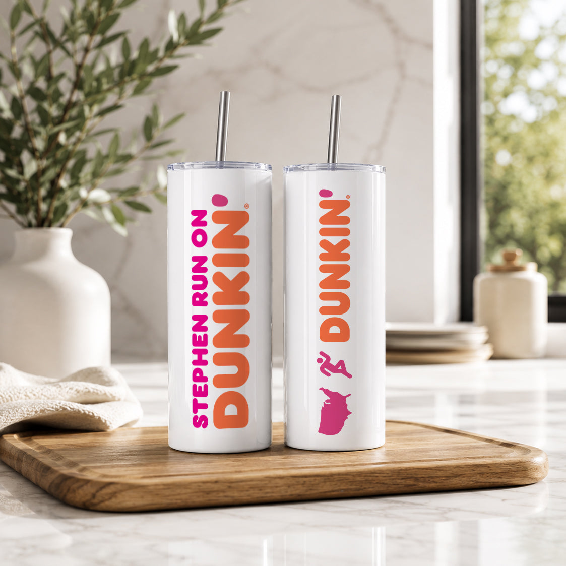 White insulated tumblers with metal straws featuring custom Dunkin style designs, displayed on a wooden tray in a bright kitchen setting, Personalized Name Tumbler – Custom Dunkin Style Insulated Cup with Straw | Custom Name Gift.