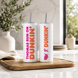 Two white insulated tumblers with metal straws featuring custom Dunkin style designs and text, displayed on a wooden tray in a bright kitchen setting, showcasing the Personalized Name Tumbler – Custom Dunkin Style Insulated Cup with Straw | Custom Name Gift.
